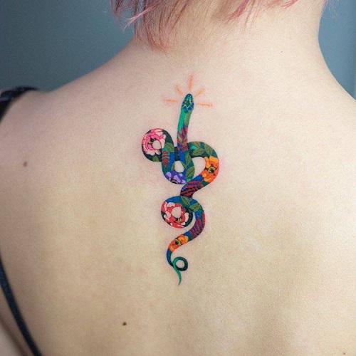 Colorful-floral-snake-tattoo-on-the-back