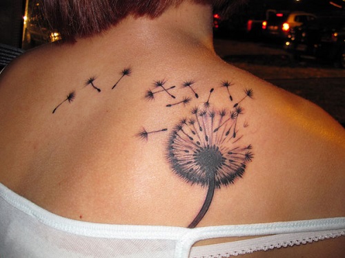 Dandelion-Blowing-From-Puff-In-Light-Brown-And-Black-Ink-On-Left-Upper-Back-For-Girl